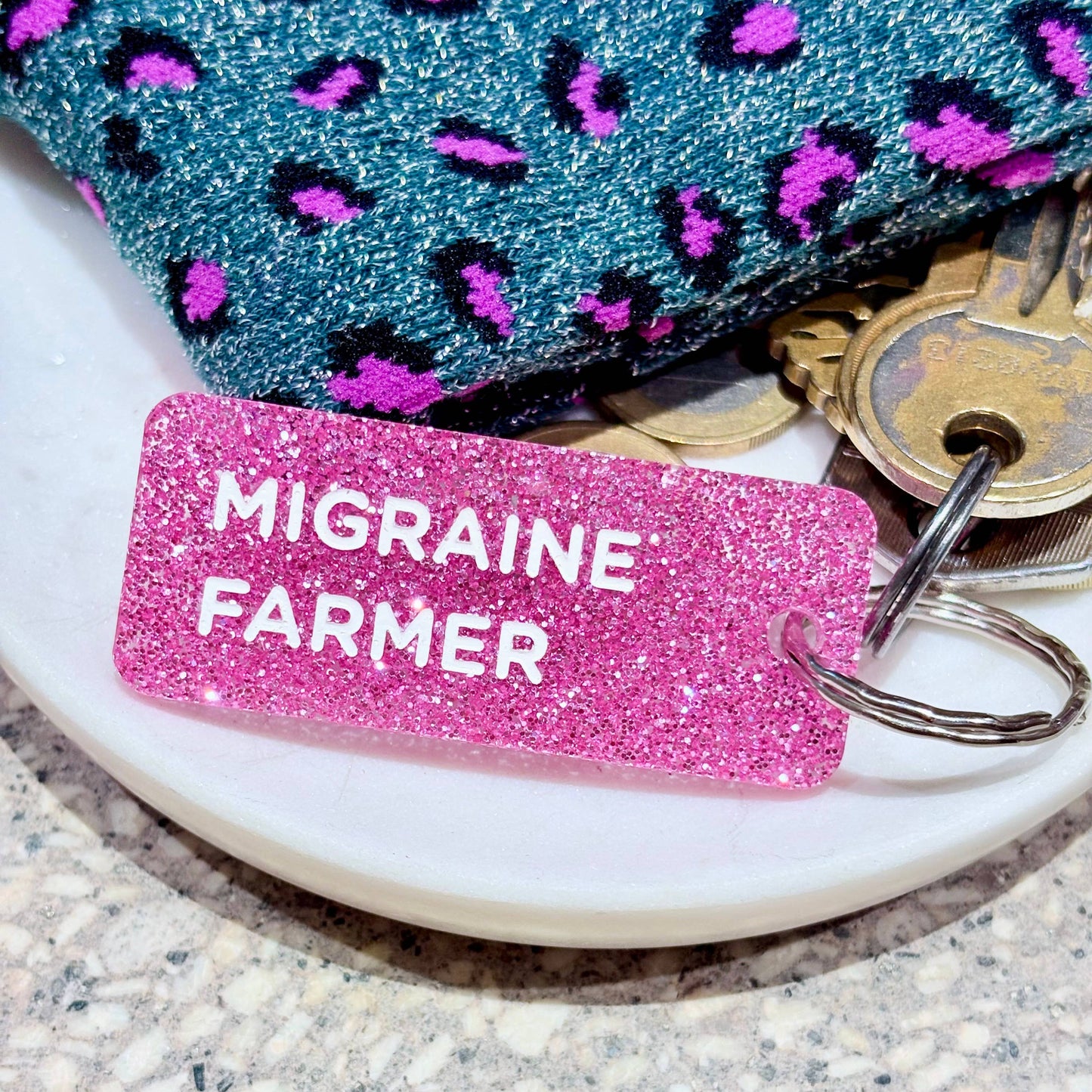 Porte clé à paillettes : migraine farmer